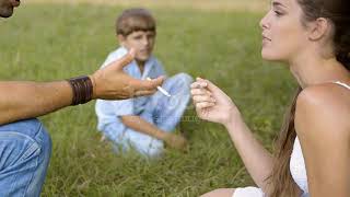 Little Boy Looking At Parents Smoking Cigarette And Talking Stock Video   Download Video Clip Now