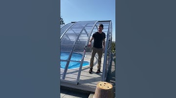 Retractable pool enclosure entrance through side sliding doors - swim year long & clean less!