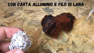 Cagnolino tenerissimo con carta alluminio e filo di lana