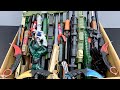Boxes Of Toy Rifles, Wooden Weapons, Karambit Knives, Military Rifles And Military Equipment