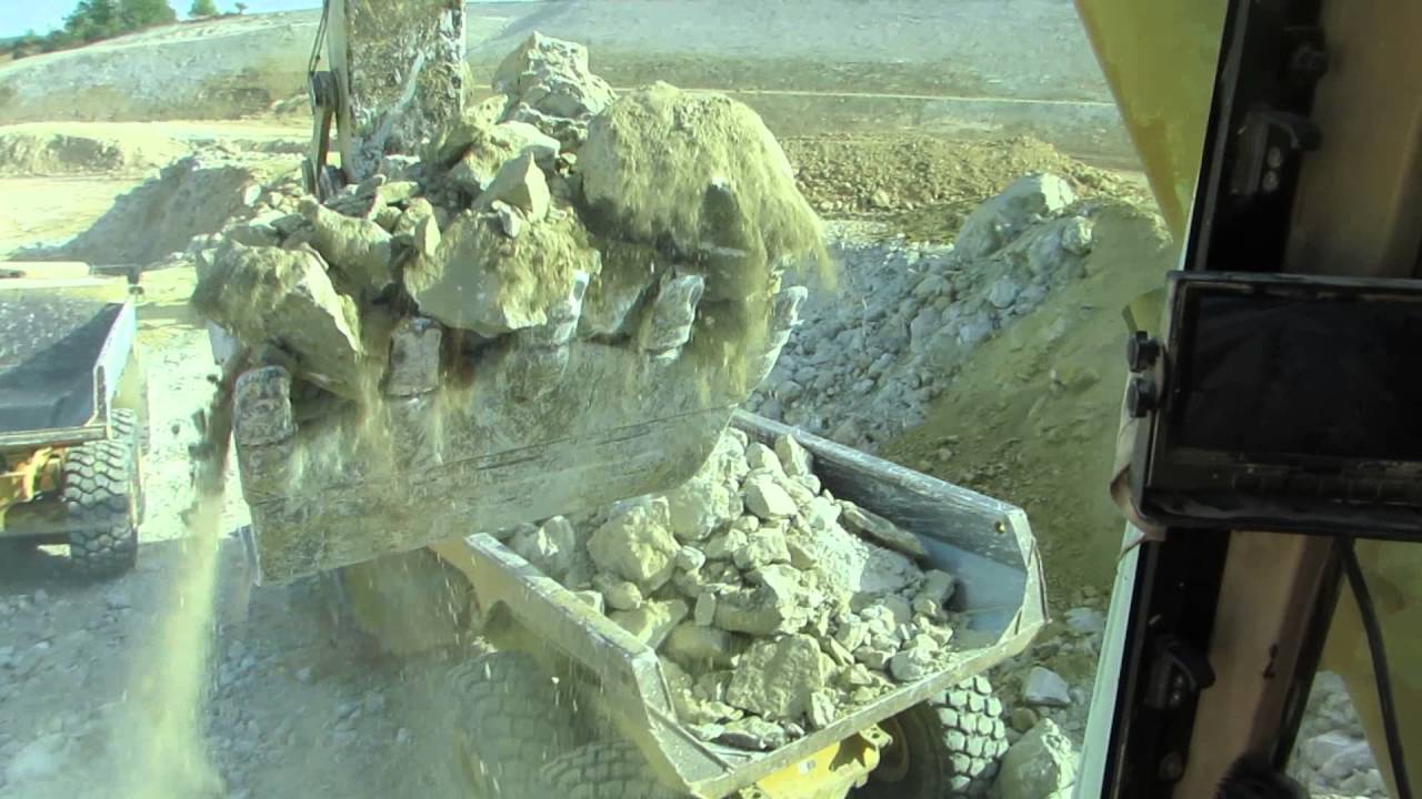 Caterpillar 385B loading Volvo A40F and Bell B45D - Cab view