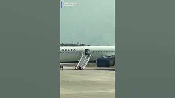 Passengers were forced to evacuate after a Delta Air Lines plane burst into flames on the tarmac