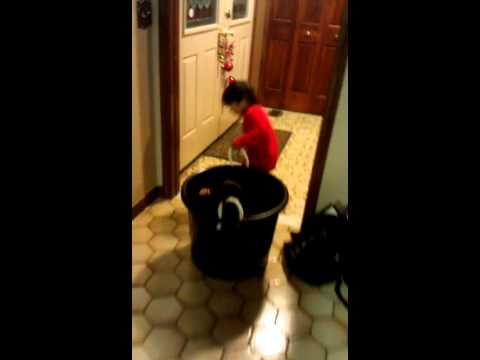 Raphael pulling a bucket with Gabriel inside the b