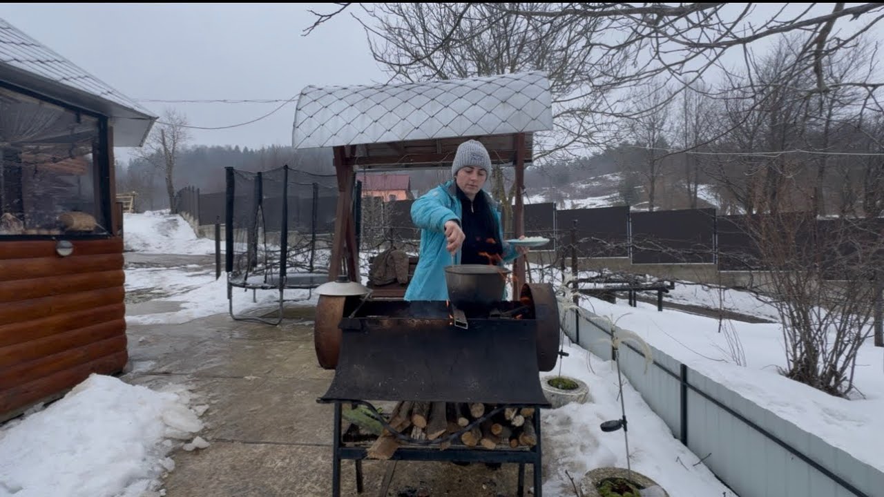 Sergiy and Galyna cooking on a grill in the Carpathian Mountains#livingheritage#mountains#carpathian