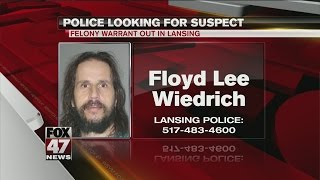 Police search for suspect with felony warrant out in Lansing