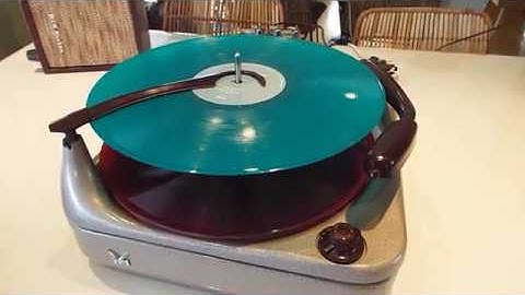 Voice of Music record changer playing a few LP records.