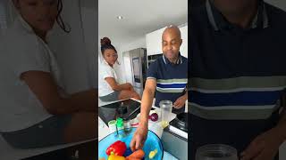 Power couple cooking delicious food  roasted vegetables with salmon