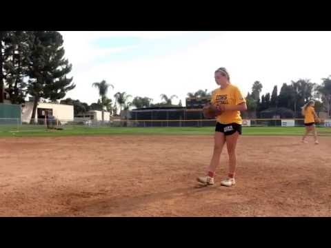 Sophomore, Sarah, warms up for the next inning