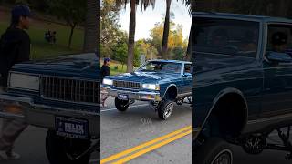 CHEVY CAPRICE LOWRIDER hitting switches on Chrome Hydraulics in Elysian Park, Los Angeles California