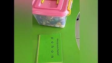 Menyusun huruf dengan tutup botol