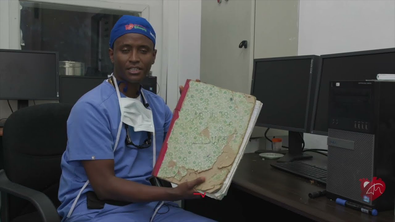 A hand-written waiting list contains the names of thousands of patients awaiting cardiac care