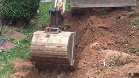 Bobcat Excavator Digging a Trench