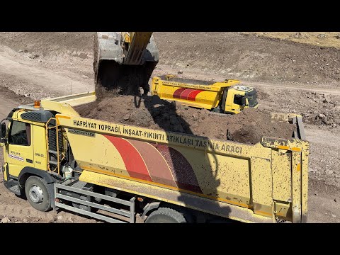 I load soil into trucks with a Sumitomo excavator.