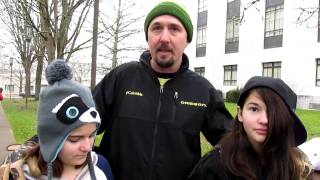 A Father with his daughters, bearing arms together for their Rights.