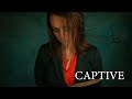 AN AMBITIOUS BUSINESSWOMAN IS ABDUCTED BY A SERIAL KILLER. CAPTIVE. THRILLER