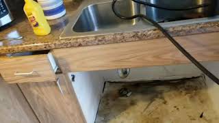 Replacement of kitchen sink cabinet base.