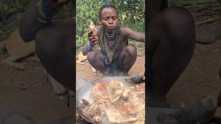 Hadzabe warrior eating forest pig leg meat like soldier #reels #wildlife #trending #shorts #foodie