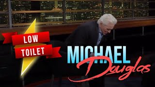 Actor Michael Douglas illustrates how hard it can be to sit on a low toilet