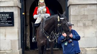 IDIOT he holds on TIGHTLY to the horse with Bridle to get a nice photo