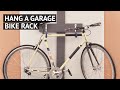 Hang a garage bike rack Hang a garage bike rack