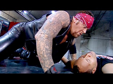 The Undertaker Tombstones The Rock onto a limo: SmackDown, Feb. 7, 2002