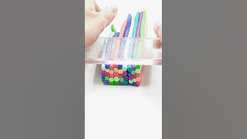 Artist is creating a vibrant colorful cane with polymer clay!