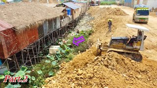 Wonderful teamwork Continued to Process Push the Rocky soil by using Mitsubishi Dozer with DumpTruck