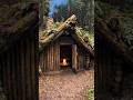 This shelter is straight out of a storybook!🐺🌿#bushcraft #husky #primitiveshelter #logcabin