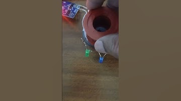 Copper wire coil on a bobbin acts as a pickup receiver coil for a wireless charging transmitter unit