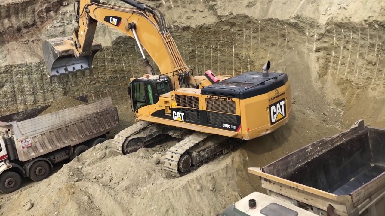 Caterpillar 385C Excavator Loading Caterpillar Dumpers And Trucks - Kivos Ate