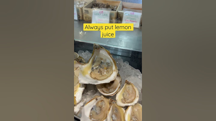 Trying a giant raw oyster…