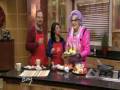 Dame Edna cooking with sausages on The View From The Bay LIVE