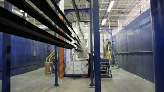 Progressive Powder Coating Company s newest line coating 30-foot long aluminum light poles
