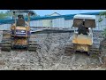 bulldozer pushing mud