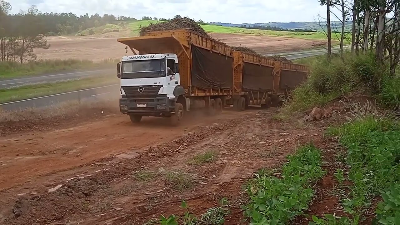 Scania treminhão canavieiro,e axor 3340 subindo morro carregado de cana (cooperval)