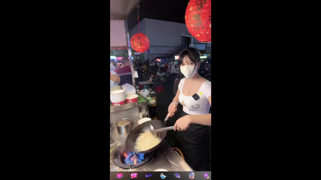 LIVE. Girl cooking on the street. beautiful girl.