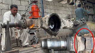 An Expert Mechanic Fixing Broken Axle Housings Due to Overload