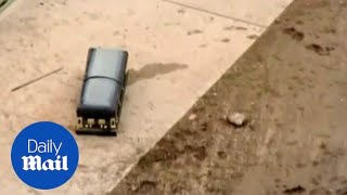 Widower finds his late wife's casket floating in flood water - Daily Mail