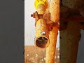 "Drill secures metal strip, wall reinforced with precise fastening."