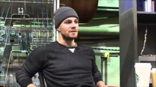 Arrow Interview: Stephen Amell on Malcolm and Oliver's Reunion