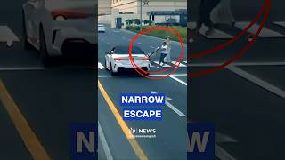 Dubai driver nearly hits family after running red light