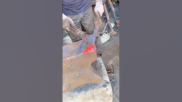 Red Hot Metal Forging Hammering a Newly Shaped Axe Blade on a Heavy Anvil