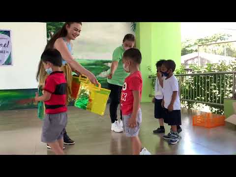 Donating school supplies to kinder children