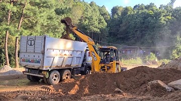 jcb loading soil in a dump truck