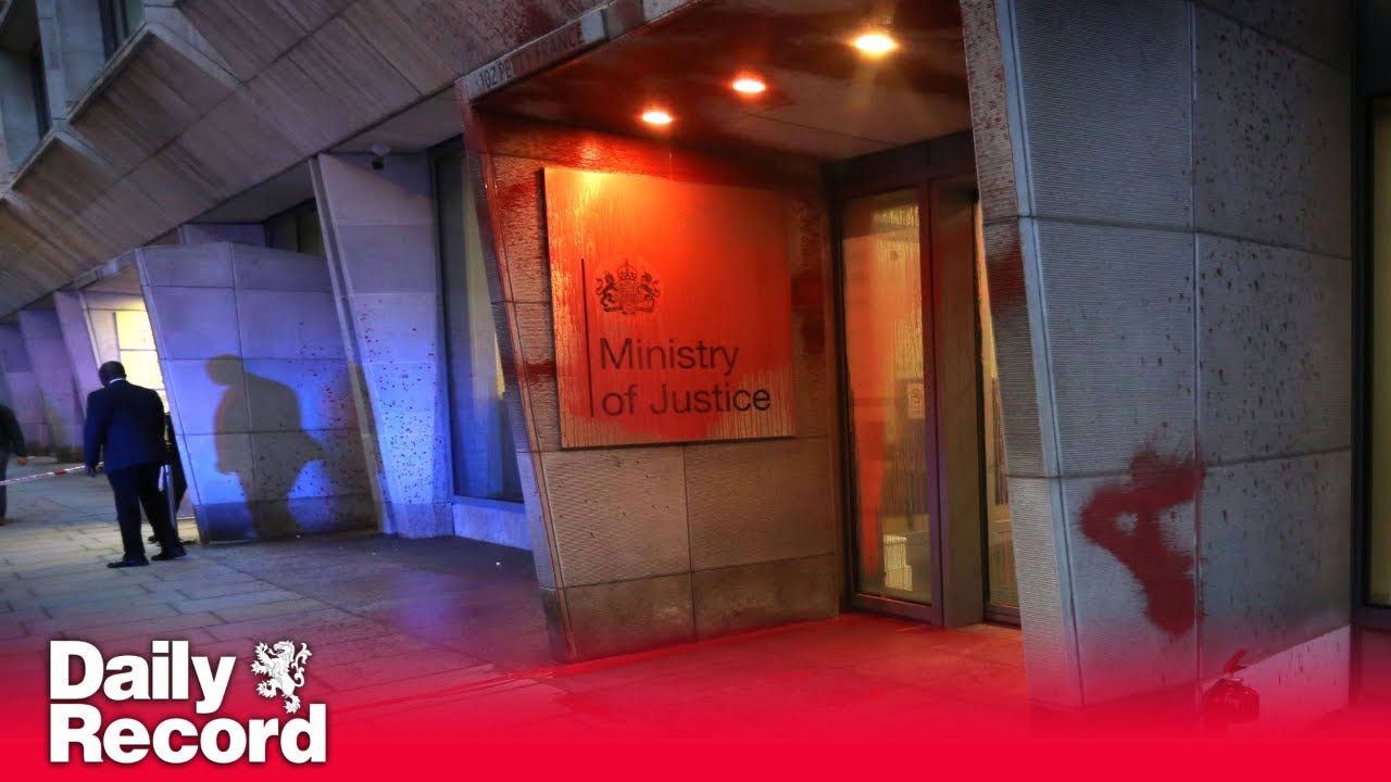 Protesters appear to spray red paint on Ministry of Justice building