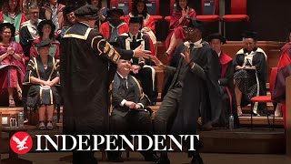 Student breaks into epic celebratory dance at graduation ceremony