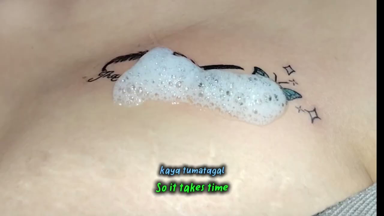 Feather butterfly tattoo