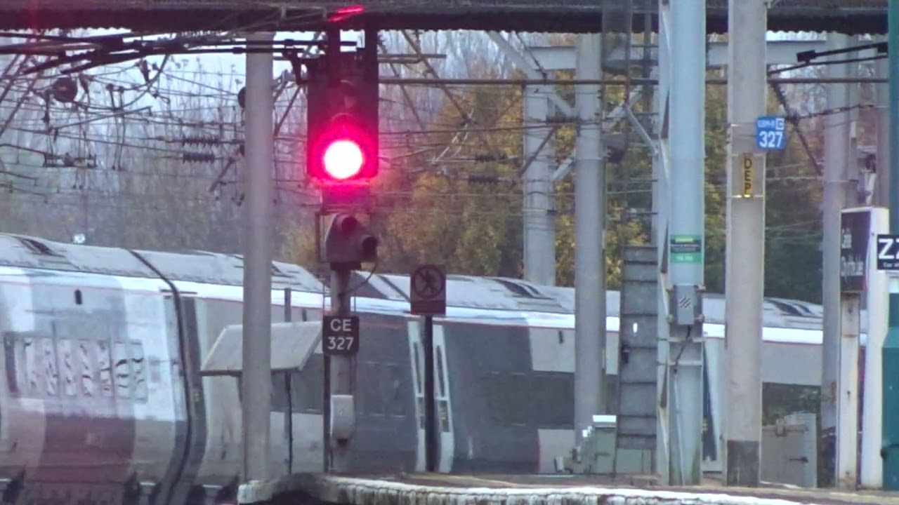 The Class 390 'Pendolino' Avanti West Coast No.390155 'Railway Benefit Fund' leaves at Carlisle.
