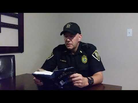 Lt. Nick Berzac of the Merrillville Police Department reads the first ...