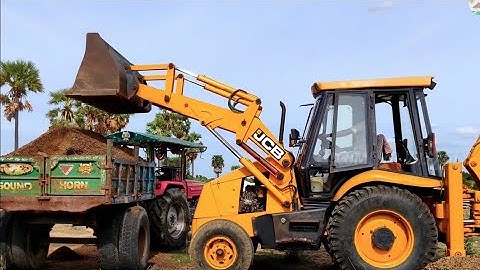 New Jcb 3dx Backhoe Machine Loading Red Mud In Mahindra Tractor
